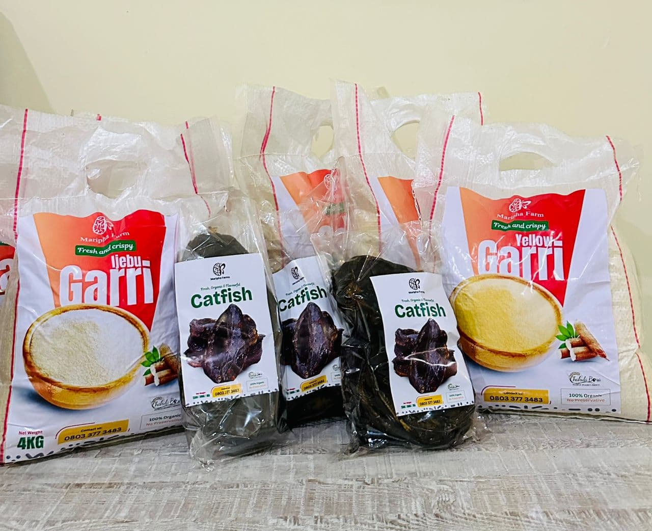 Maripha Farm branded products — Ijebu garri, yellow garri, and dried catfish